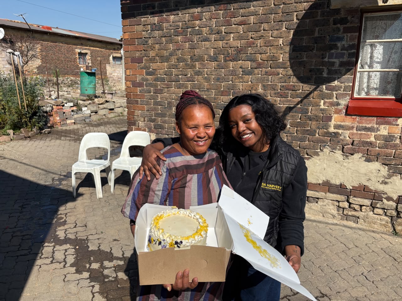 Chef Pinky presents a cake to Alice Modiri - honouring her tradition of giving and reminding her that her endless care does not go unnoticed.